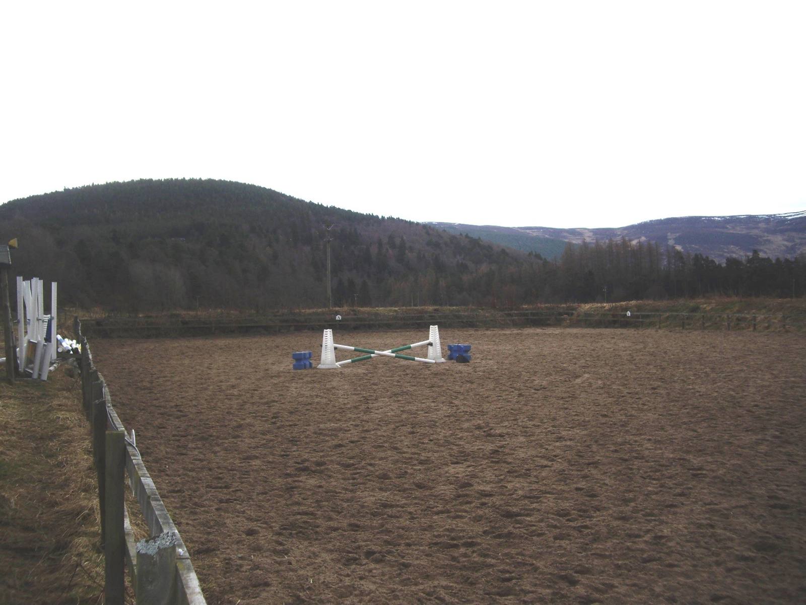 White rail fence around a riding paddock